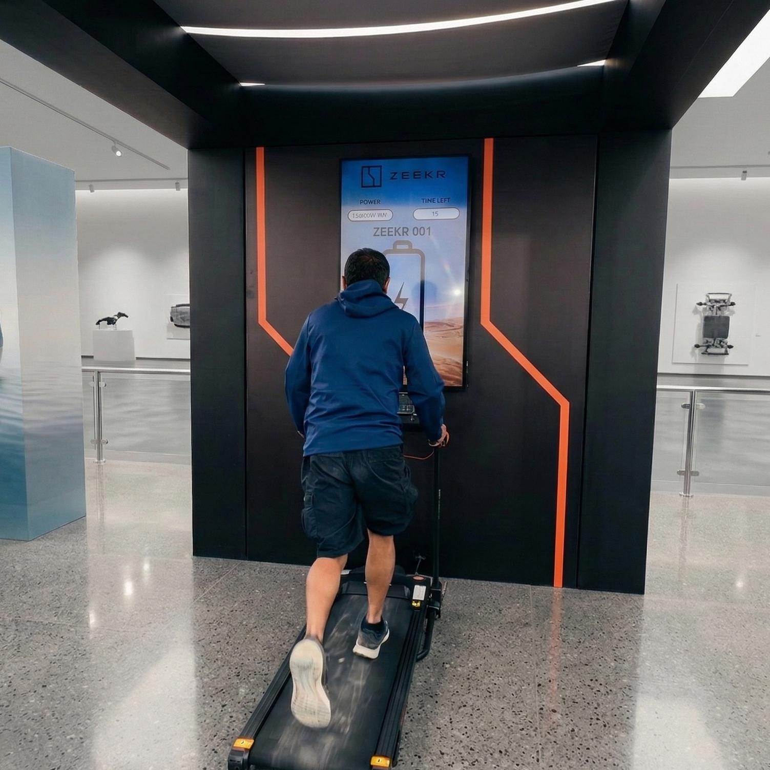 Interactive Treadmill Activation in Dubai: Participants generating human power to recharge EV cars
